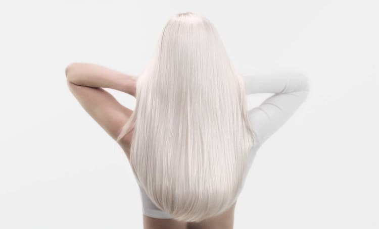 Image showing woman illustrating anti-breakage methods suitable for healthier, stronger looking hair